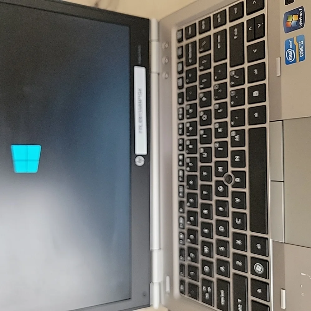 HP Silver and Black Laptop with Sleek Design and QWERTY Keyboard